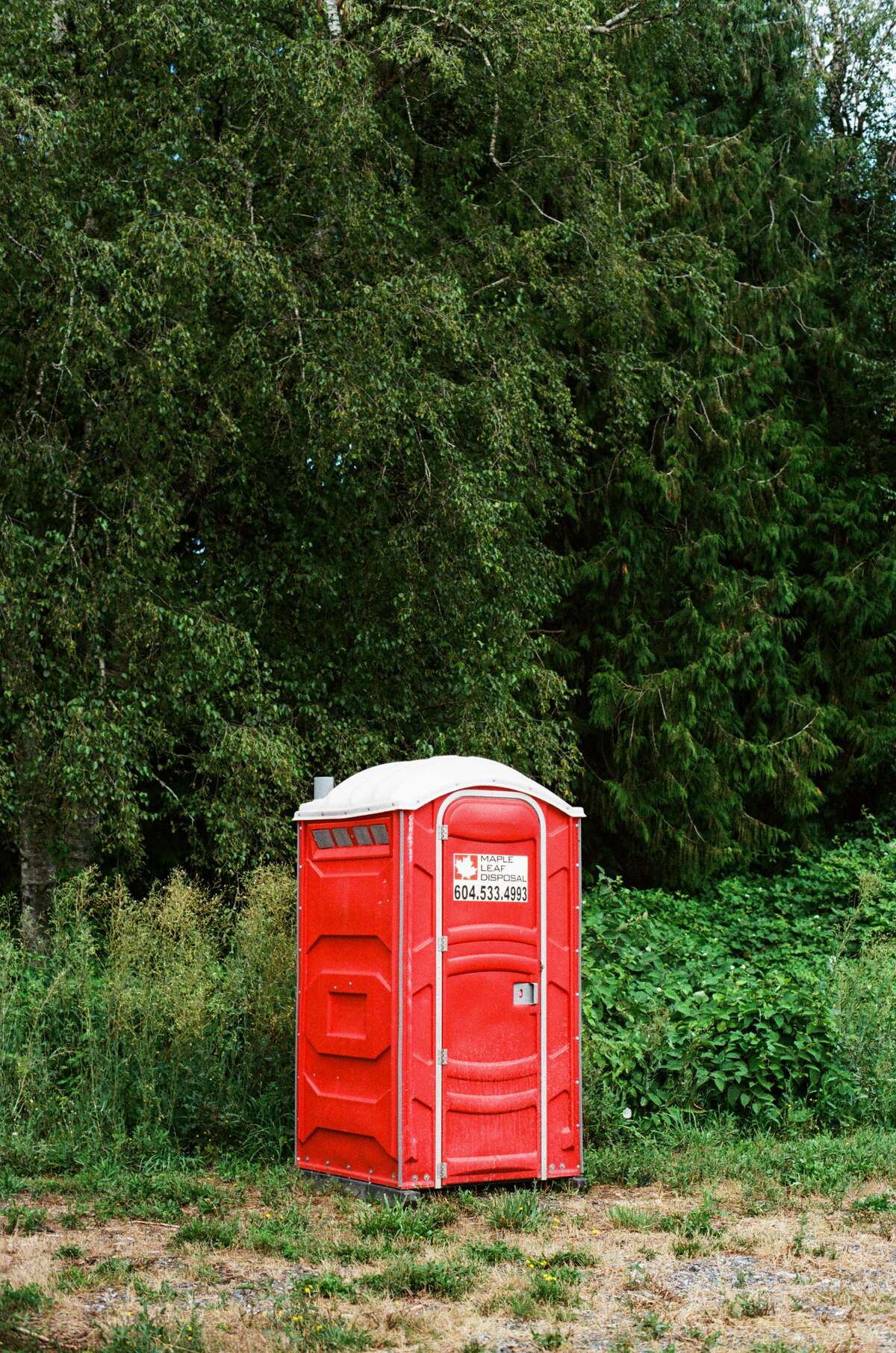 Portable toilet unit placed at a remote construction site near Newport Beach
